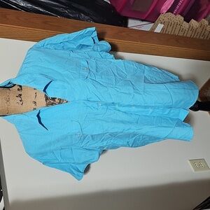 24w Blue And White Button Up Tshirt With A Collar.